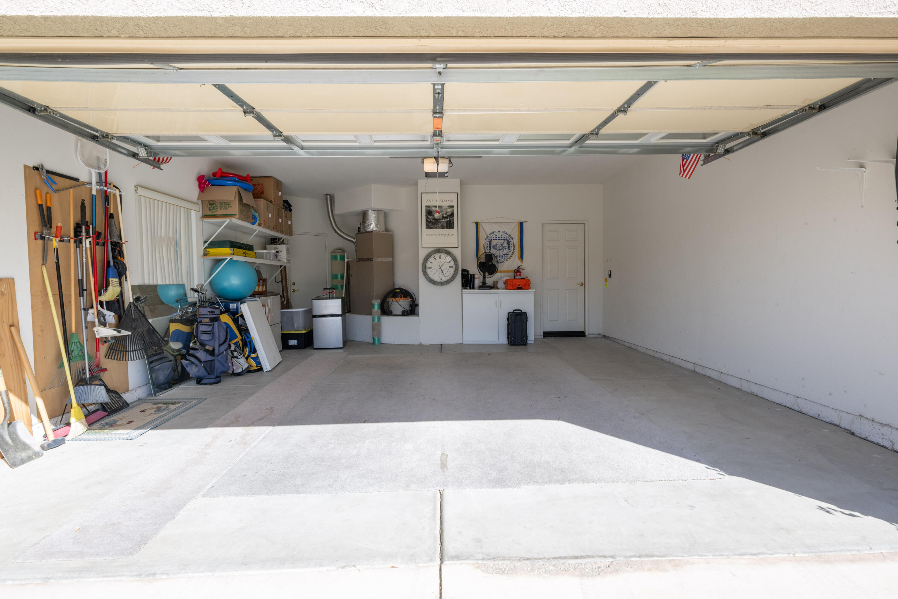 45138 Banff Springs Street Indio, CA 92201 - Photo 20 of 38 a view of a garage with rack and bicycle