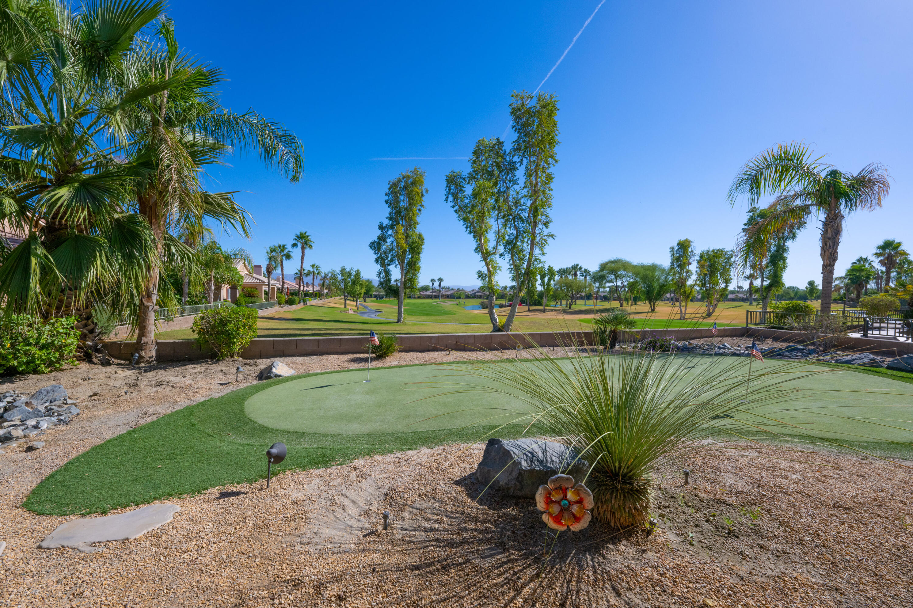 45138 Banff Springs Street Indio, CA 92201 - Photo 23 of 38 a view of a park with a palm trees