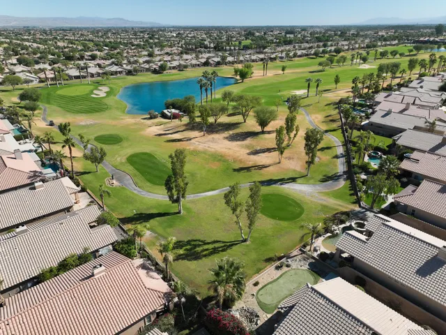 an aerial view of a house with outdoor space