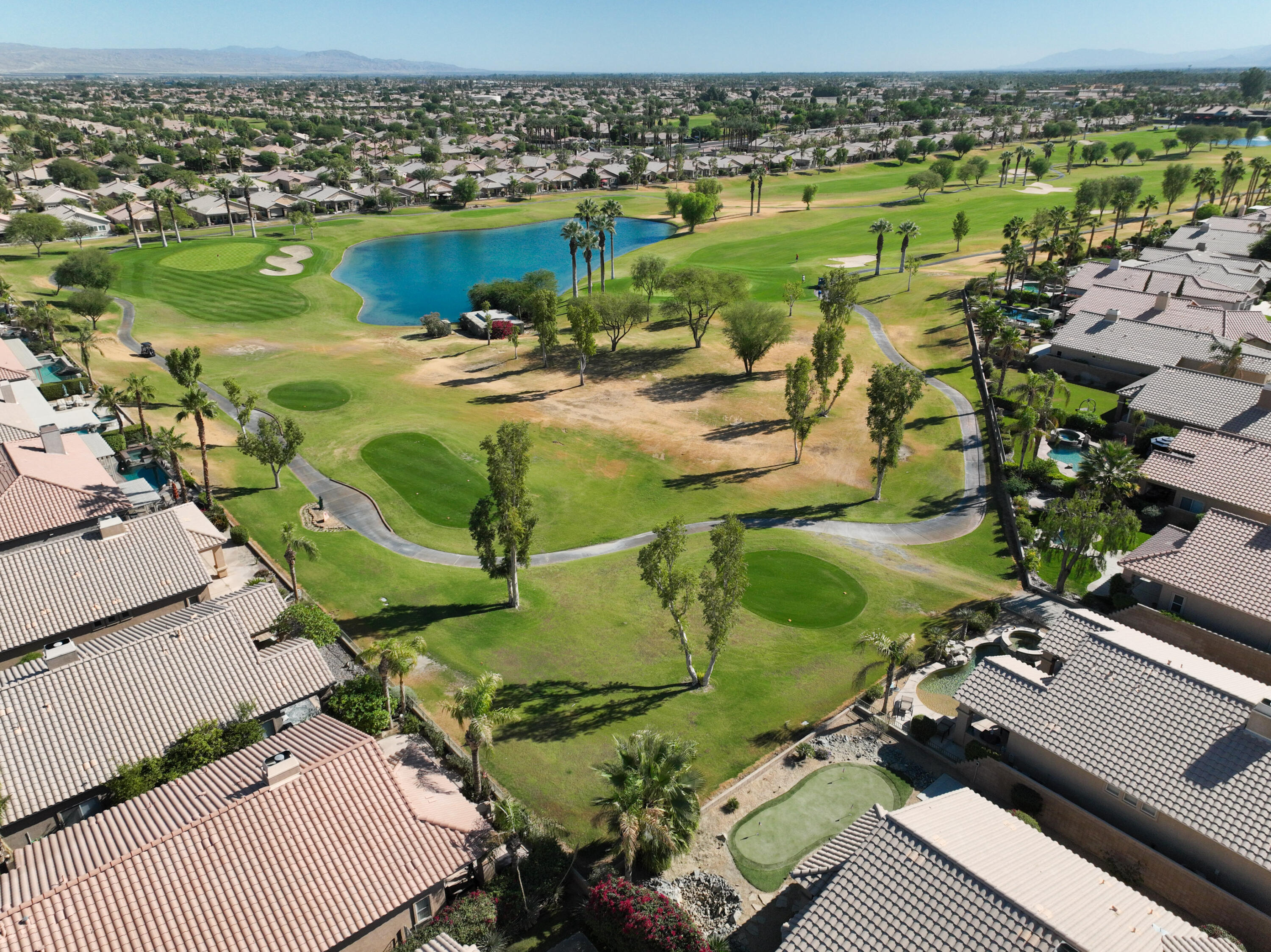 45138 Banff Springs Street Indio, CA 92201 - Photo 28 of 38 an aerial view of a house with outdoor space