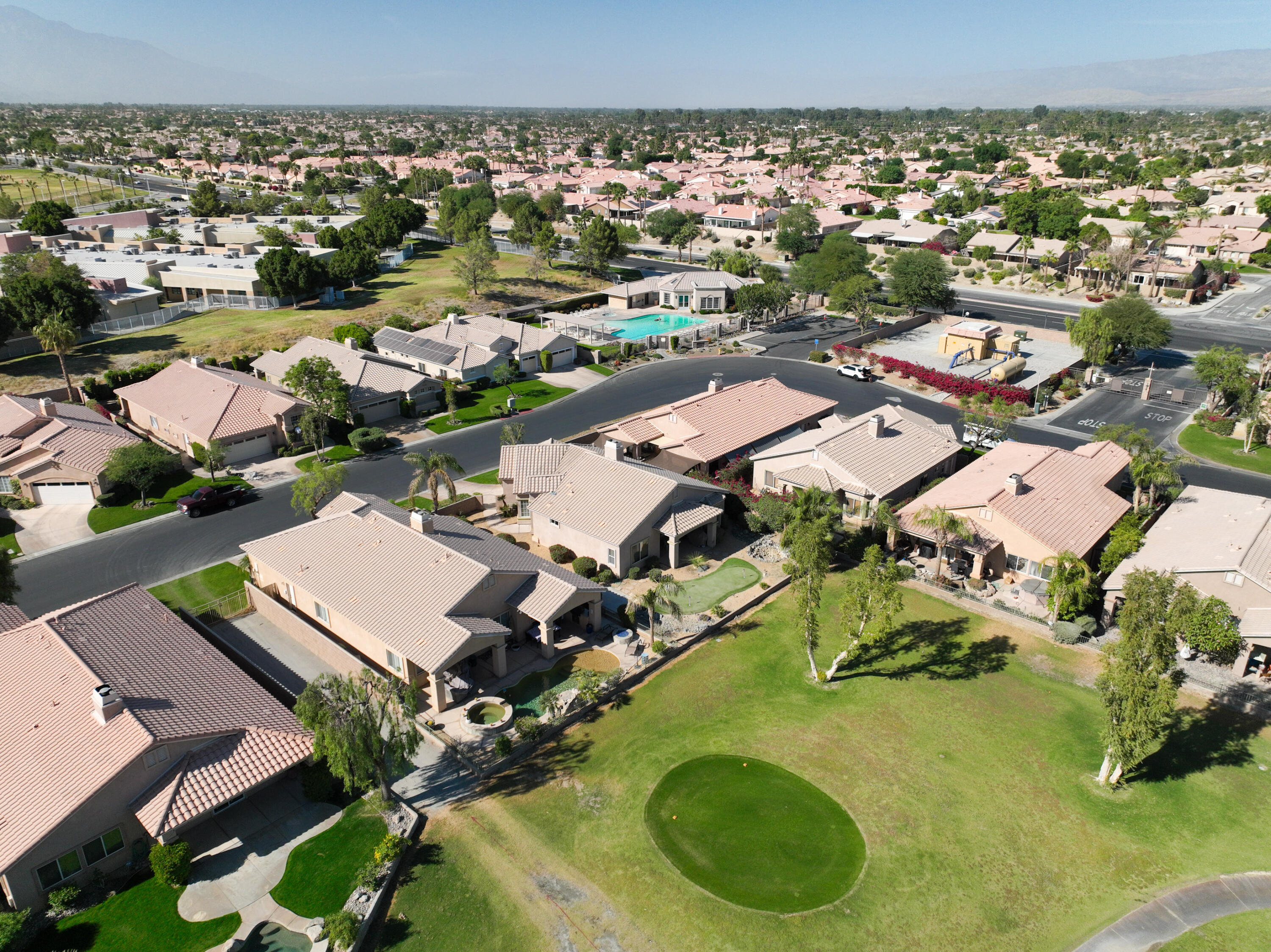 45138 Banff Springs Street Indio, CA 92201 - Photo 29 of 38 an aerial view of residential houses with outdoor space