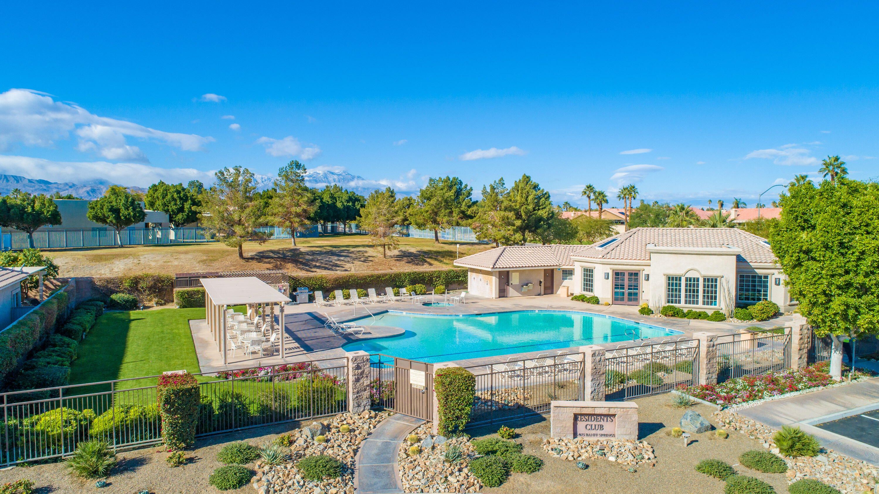 45138 Banff Springs Street Indio, CA 92201 - Photo 31 of 38 an aerial view of a house with a swimming pool yard and outdoor seating