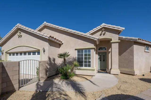 a view of a white house with large windows