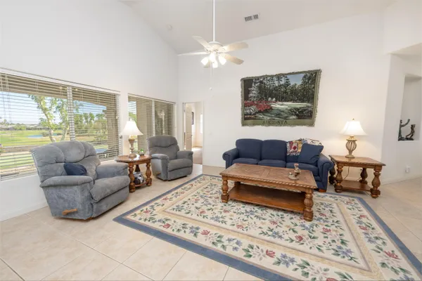 a living room with furniture and a rug
