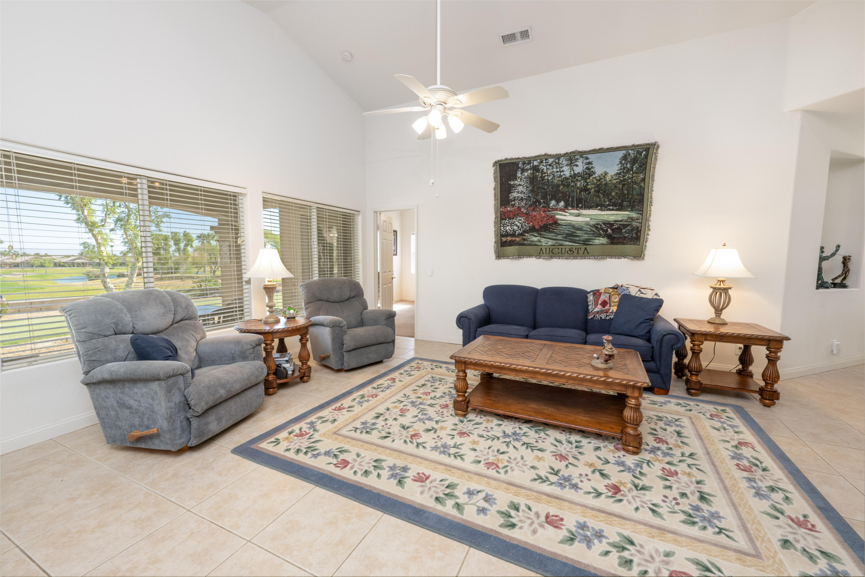 45138 Banff Springs Street Indio, CA 92201 - Photo 8 of 38 a living room with furniture and a rug