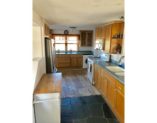 98 Cherry Street Marshfield, MA 02020 - Photo 4 of 6 a kitchen with a sink and a refrigerator