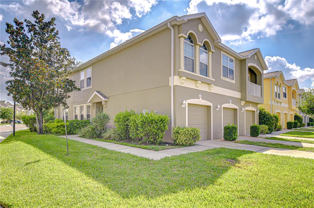 a front view of a house with a yard
