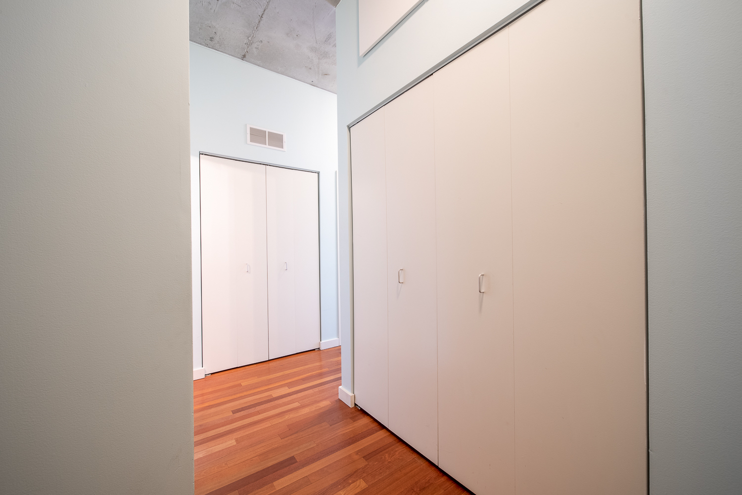 1720 South Michigan Avenue, Unit 2512 Chicago, IL 60616 - Photo 10 of 18 a view of a hallway with wooden floor