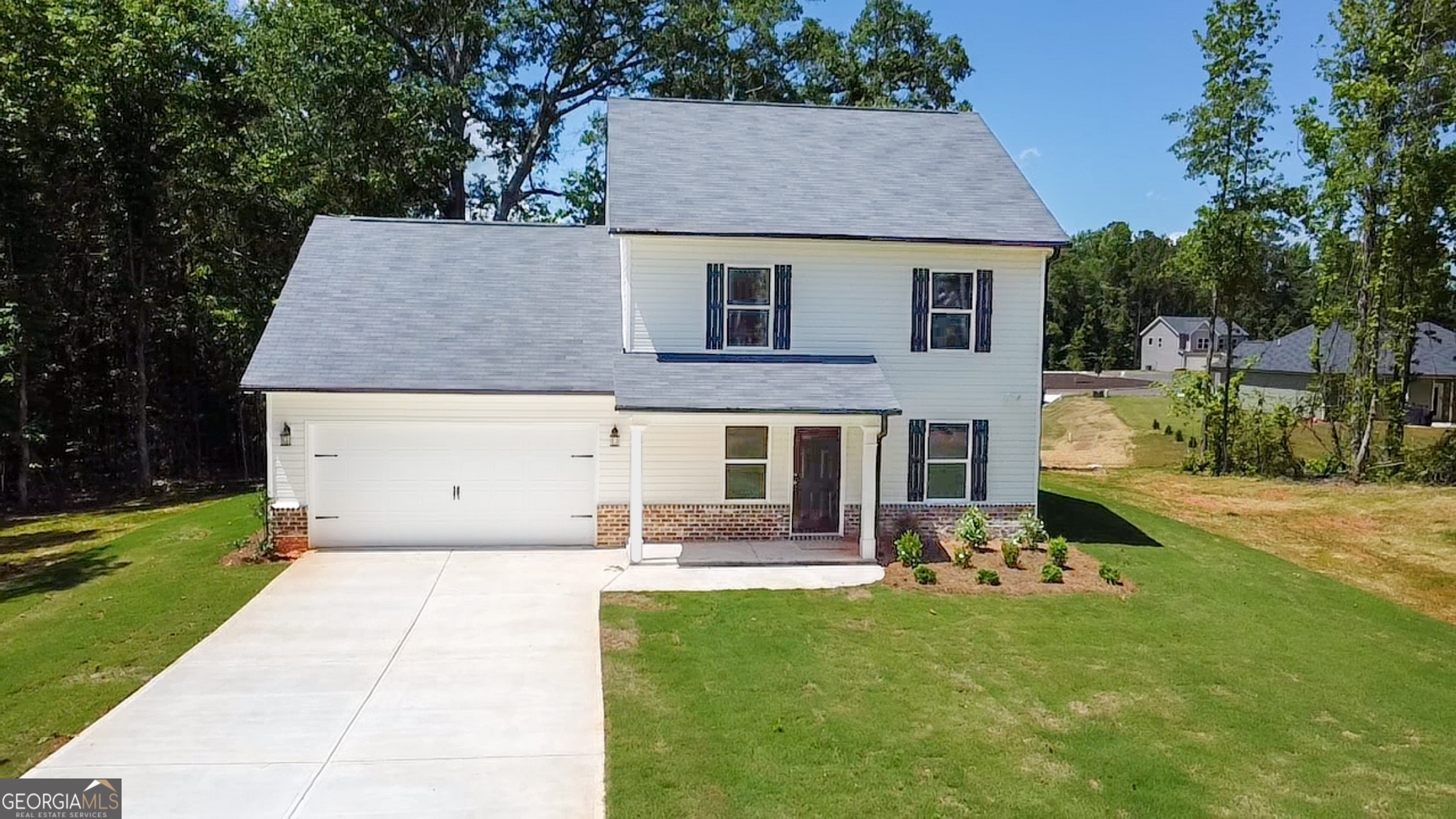68 Davis Lake Road Thomaston, GA 30286 - Photo 1 of 1 a front view of a house with garden