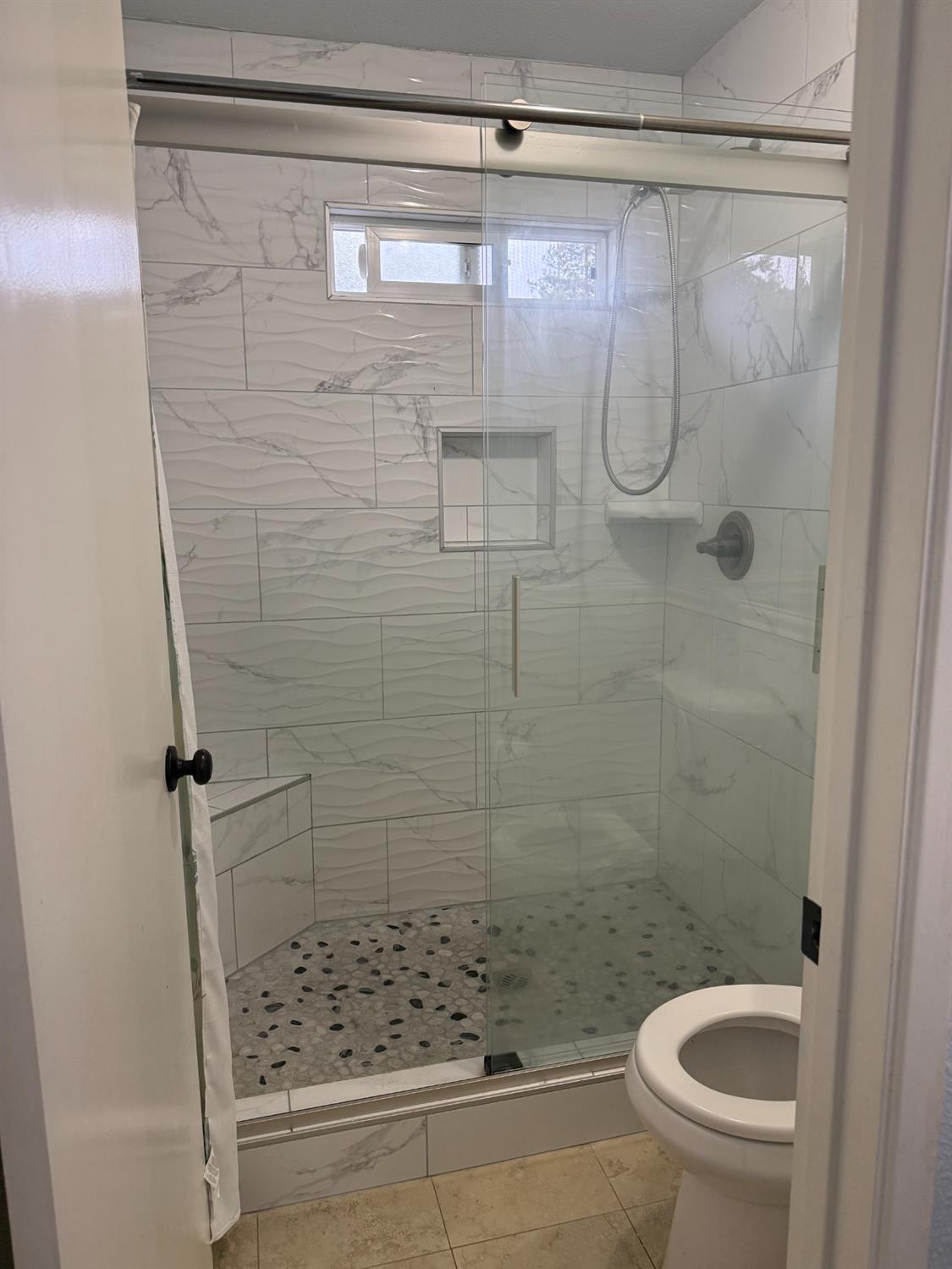 1508 Mable Avenue Modesto, CA 95355 - Photo 17 of 25 a bathroom with a shower and toilet