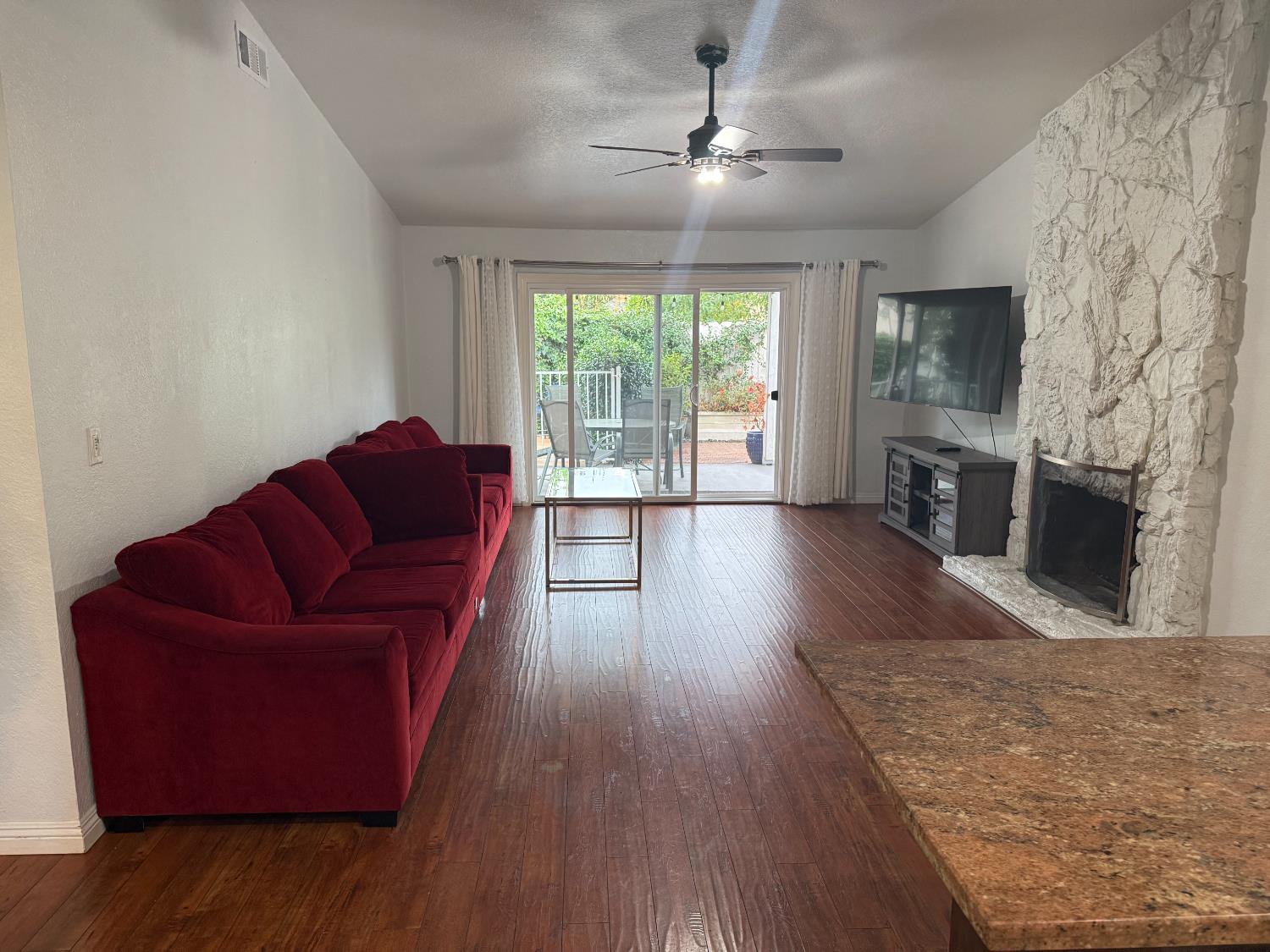1508 Mable Avenue Modesto, CA 95355 - Photo 6 of 25 a living room with furniture fireplace and flat screen tv