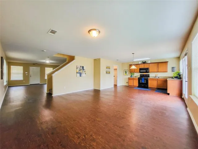 a view of a kitchen with a sink and a stove