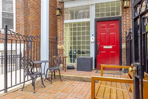 a view of front door with outdoor seating