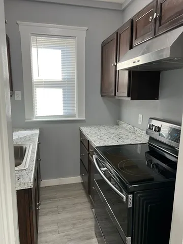 a kitchen with a stove and a microwave