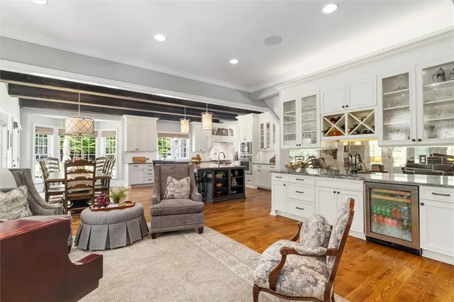 a kitchen with stainless steel appliances granite countertop a refrigerator and a stove
