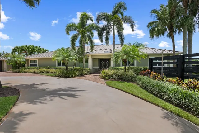 a front view of house with small garden