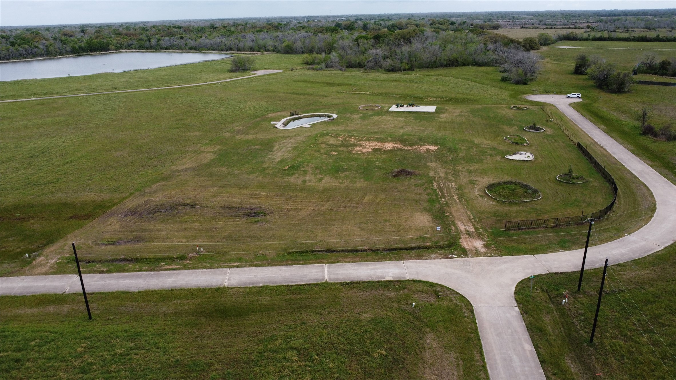 225 Cripple Creek Lane Angleton, TX 77515 - Photo 12 of 13 a view of a lake from a yard