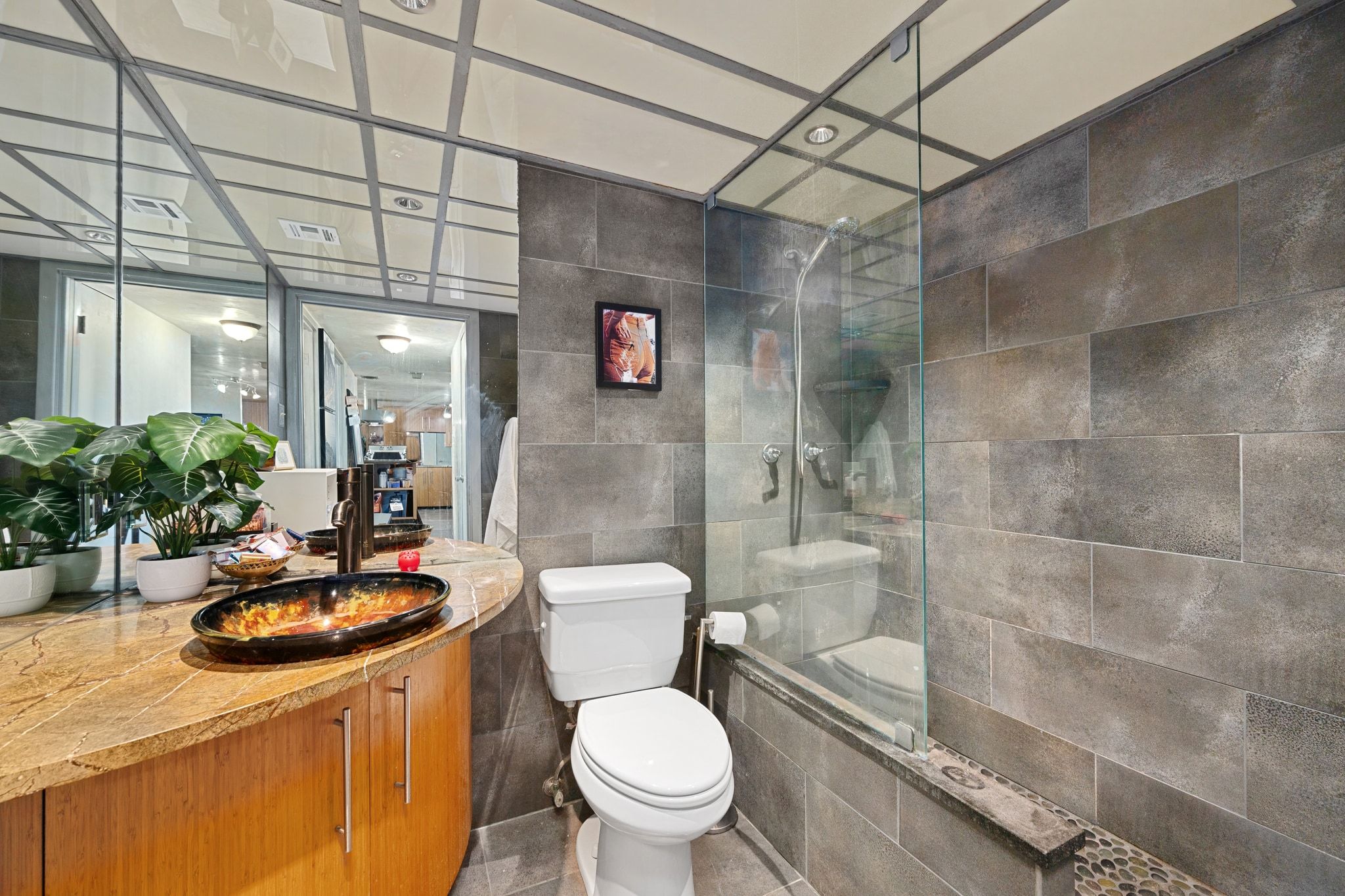 1800 Lavaca Street, Unit A208 Austin, TX 78701 - Photo 12 of 20 a bathroom with a sink a toilet and shower