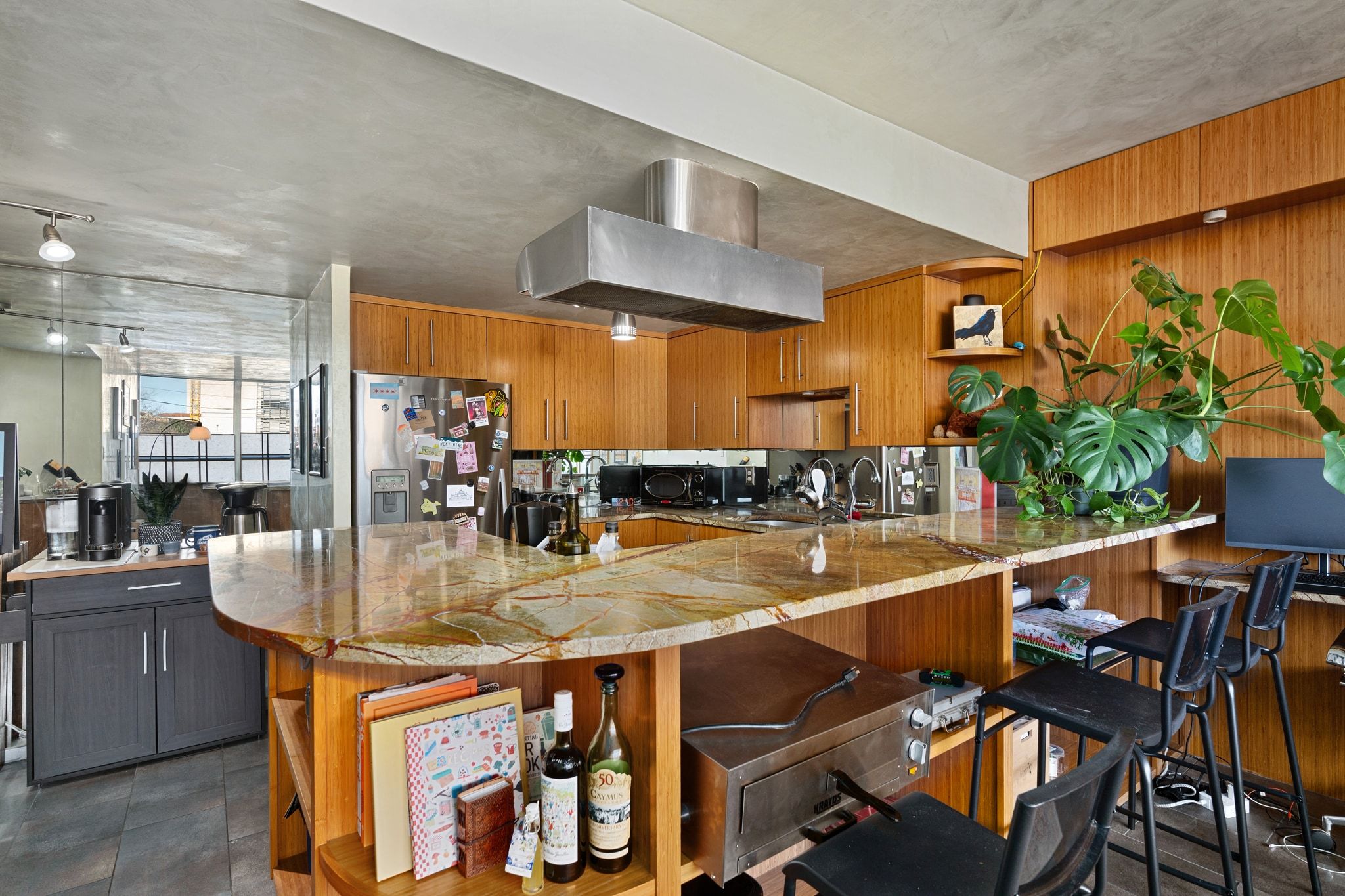1800 Lavaca Street, Unit A208 Austin, TX 78701 - Photo 6 of 20 a kitchen with stainless steel appliances granite countertop a table and chairs