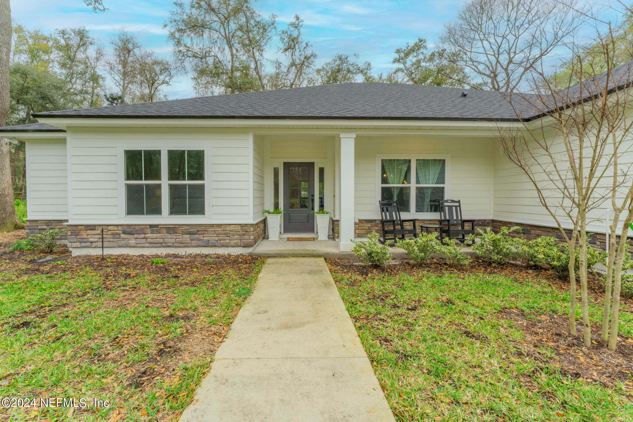 2558 Crooked Creek Point Road Middleburg, FL 32068 - Photo 3 of 56 front view of a house with a yard