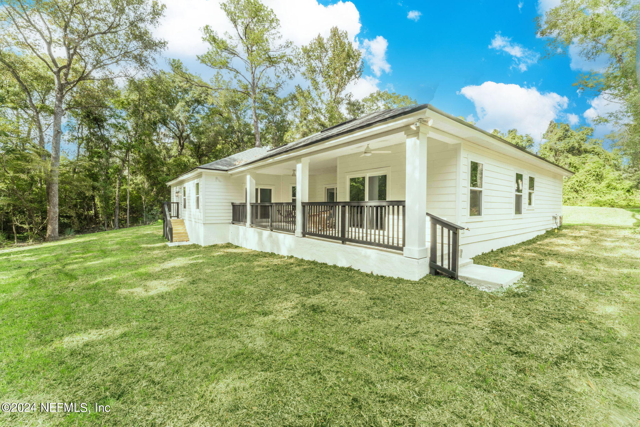 2558 Crooked Creek Point Road Middleburg, FL 32068 - Photo 46 of 56 a view of a house with a backyard