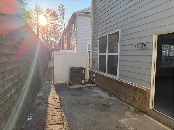 a view of a house with a door and wooden walls