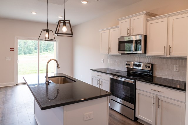 13 Cherry Acres Clarksville, TN 37042 - Photo 2 of 13 a kitchen with stainless steel appliances granite countertop a sink a stove and a microwave