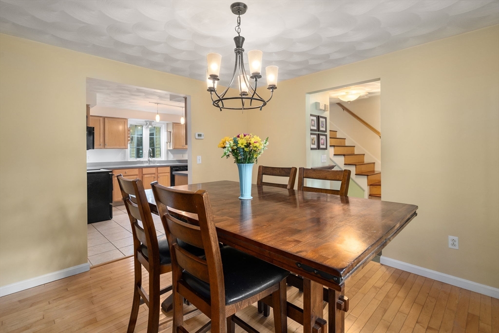 30 Martin Road Douglas, MA 01516 - Photo 11 of 33 a view of a dining room with furniture and chandelier
