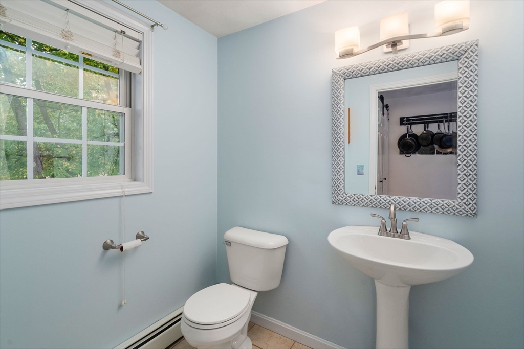 30 Martin Road Douglas, MA 01516 - Photo 13 of 33 a bathroom with a toilet sink and mirror