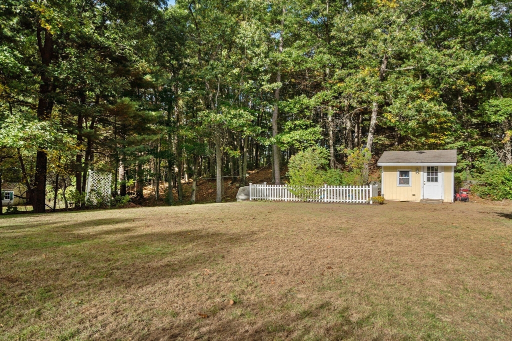 30 Martin Road Douglas, MA 01516 - Photo 22 of 33 a front view of a house with a yard and a garage