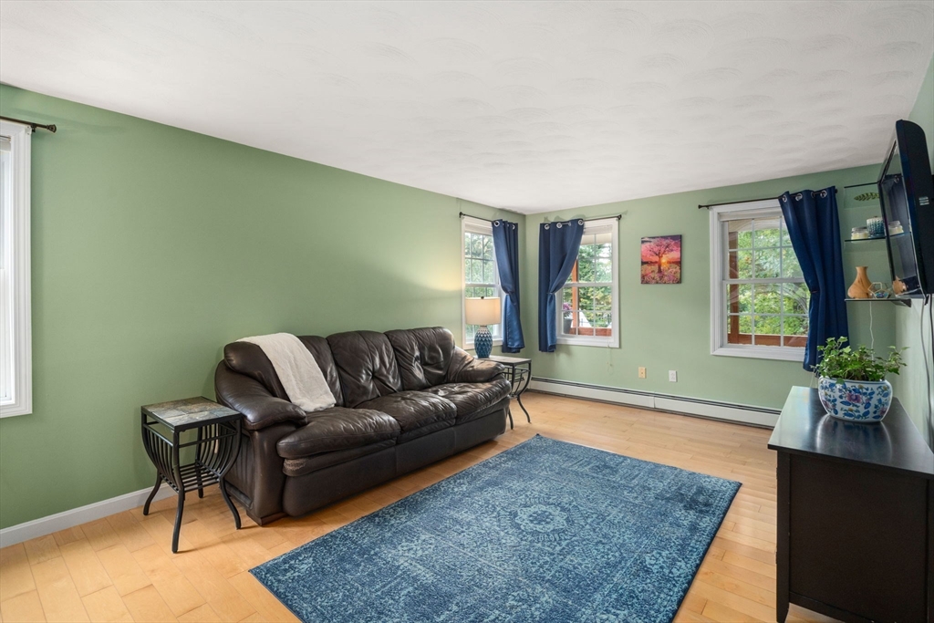 30 Martin Road Douglas, MA 01516 - Photo 4 of 33 a living room with furniture and a flat screen tv