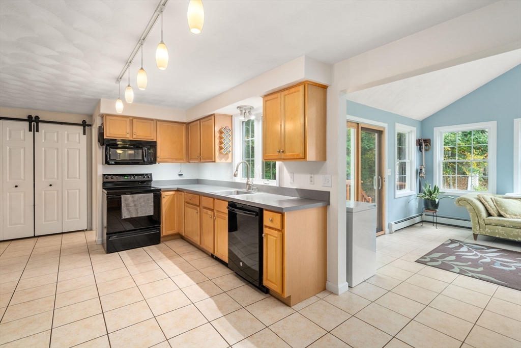 30 Martin Road Douglas, MA 01516 - Photo 7 of 33 a kitchen with stainless steel appliances granite countertop a refrigerator and a stove top oven