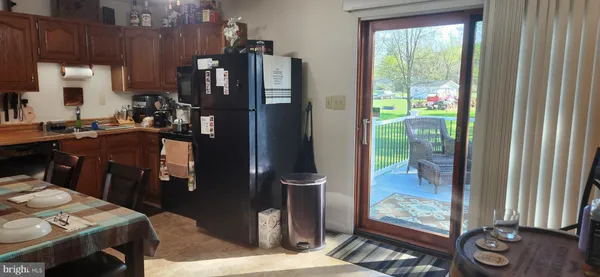 a kitchen view of a stove and a refrigerator