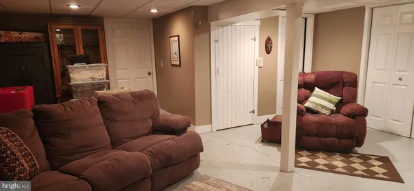 a living room with furniture and a rug
