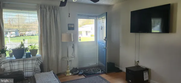 a living room with furniture and a window