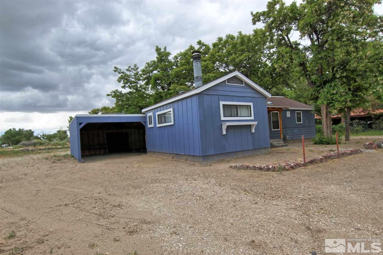 4575-4571 Alcorn Road Fallon, NV 89406 - Photo 1 of 25 a house with trees in the background