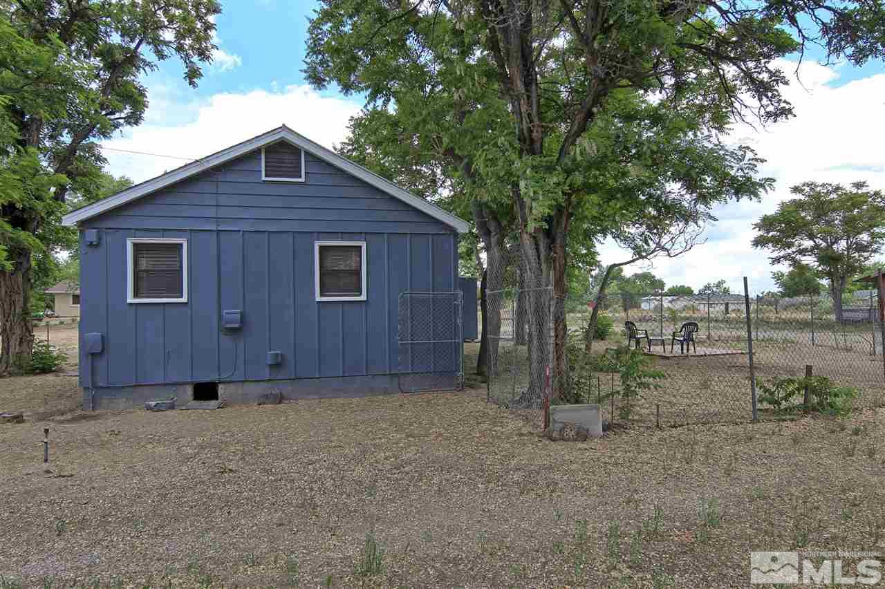 4575-4571 Alcorn Road Fallon, NV 89406 - Photo 5 of 25 a backyard of a house with lots of green space