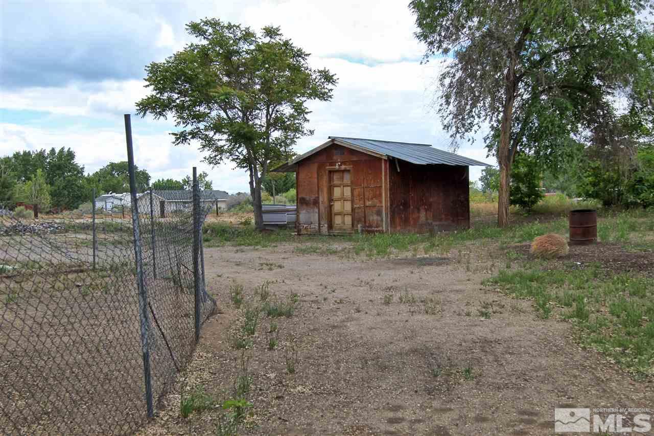 4575-4571 Alcorn Road Fallon, NV 89406 - Photo 6 of 25 a view of a house with a backyard