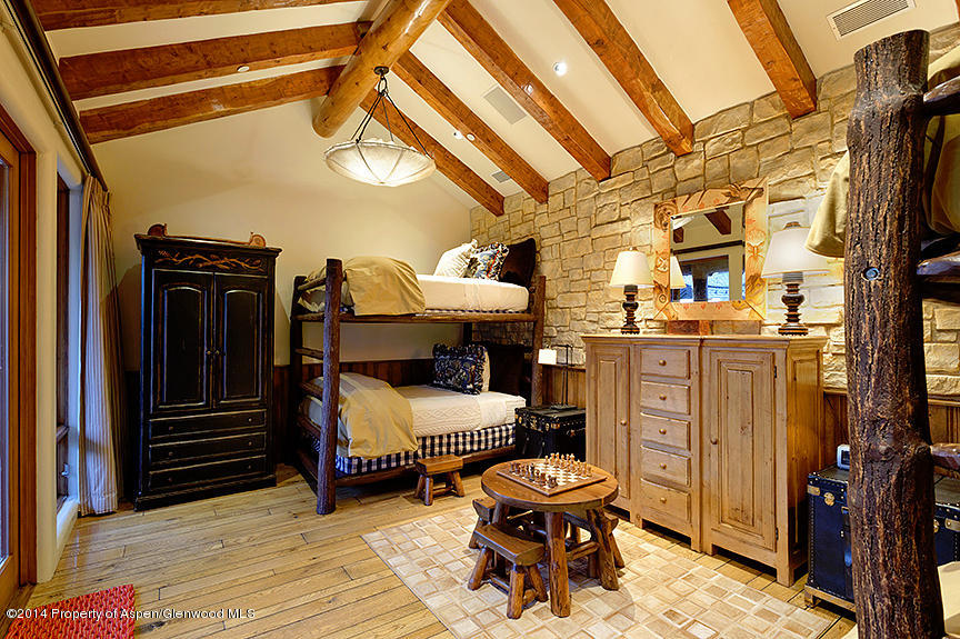 189 Larson Road Aspen, CO 81612 - Photo 11 of 28 a bedroom with furniture and wooden floor