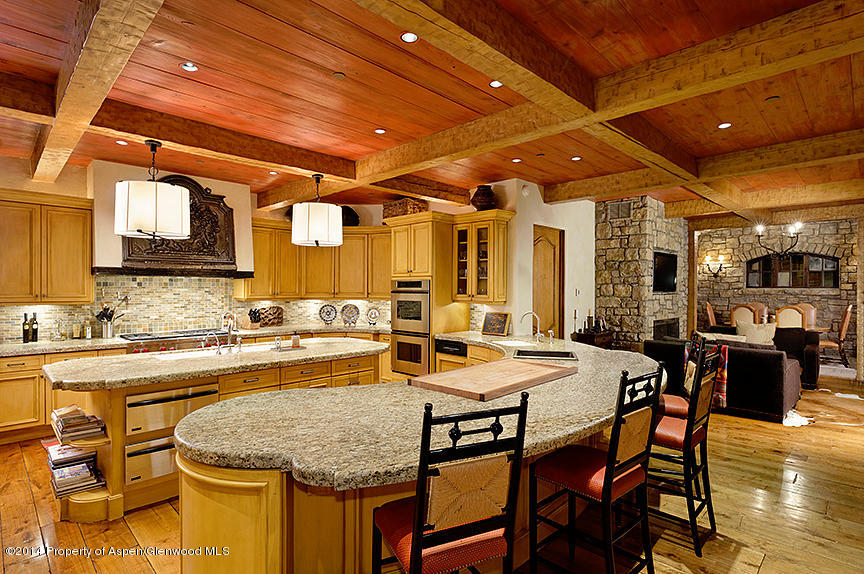 189 Larson Road Aspen, CO 81612 - Photo 18 of 28 a dining table with chairs and kitchen view
