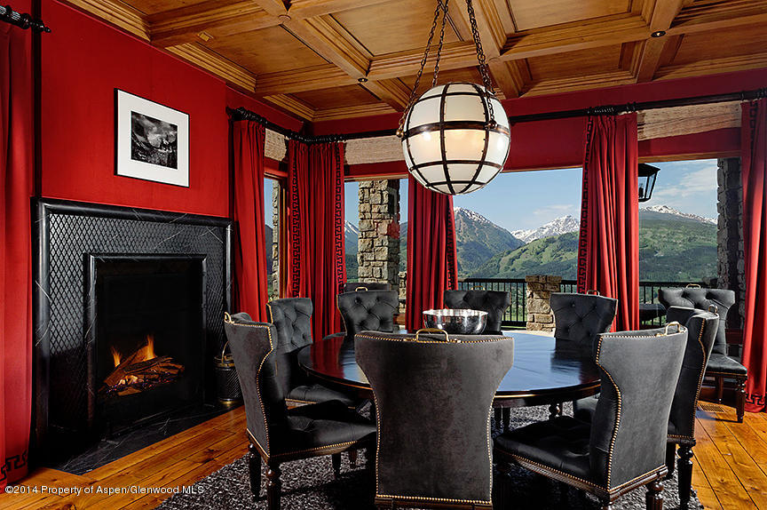 189 Larson Road Aspen, CO 81612 - Photo 21 of 28 a dining room with furniture a fireplace and a chandelier