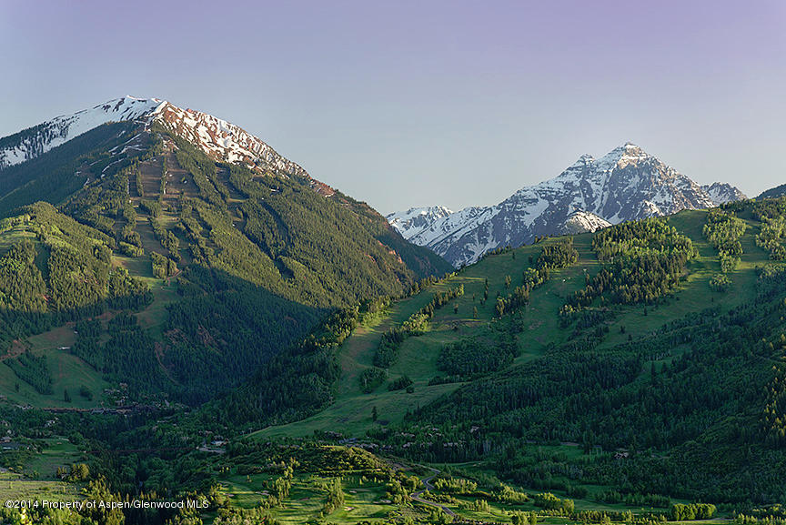 189 Larson Road Aspen, CO 81612 - Photo 25 of 28 a view of a large building with a yard