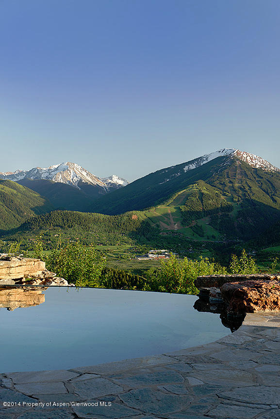 189 Larson Road Aspen, CO 81612 - Photo 26 of 28 a view of a lake with a garden