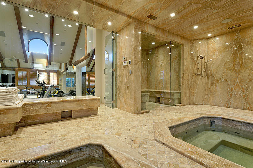 189 Larson Road Aspen, CO 81612 - Photo 9 of 28 a bathroom with a tub a sink double vanity and shower