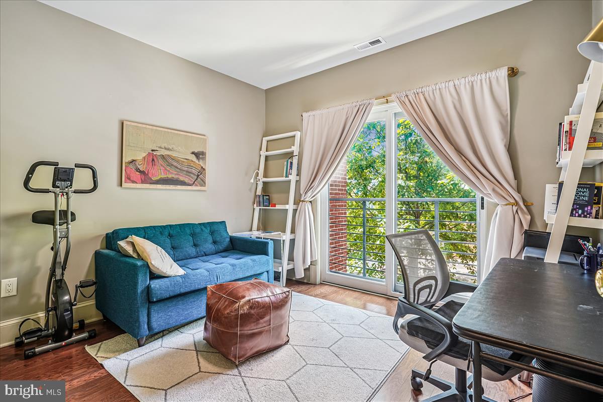 1301 H Street Northeast, Unit 2 Washington, DC 20002 - Photo 19 of 36 a living room with furniture and a window