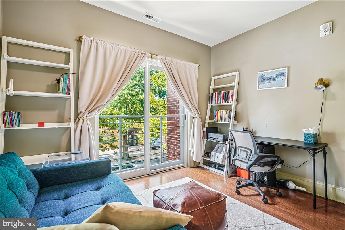 1301 H Street Northeast, Unit 2 Washington, DC 20002 - Photo 20 of 36 a living room with furniture and a large window