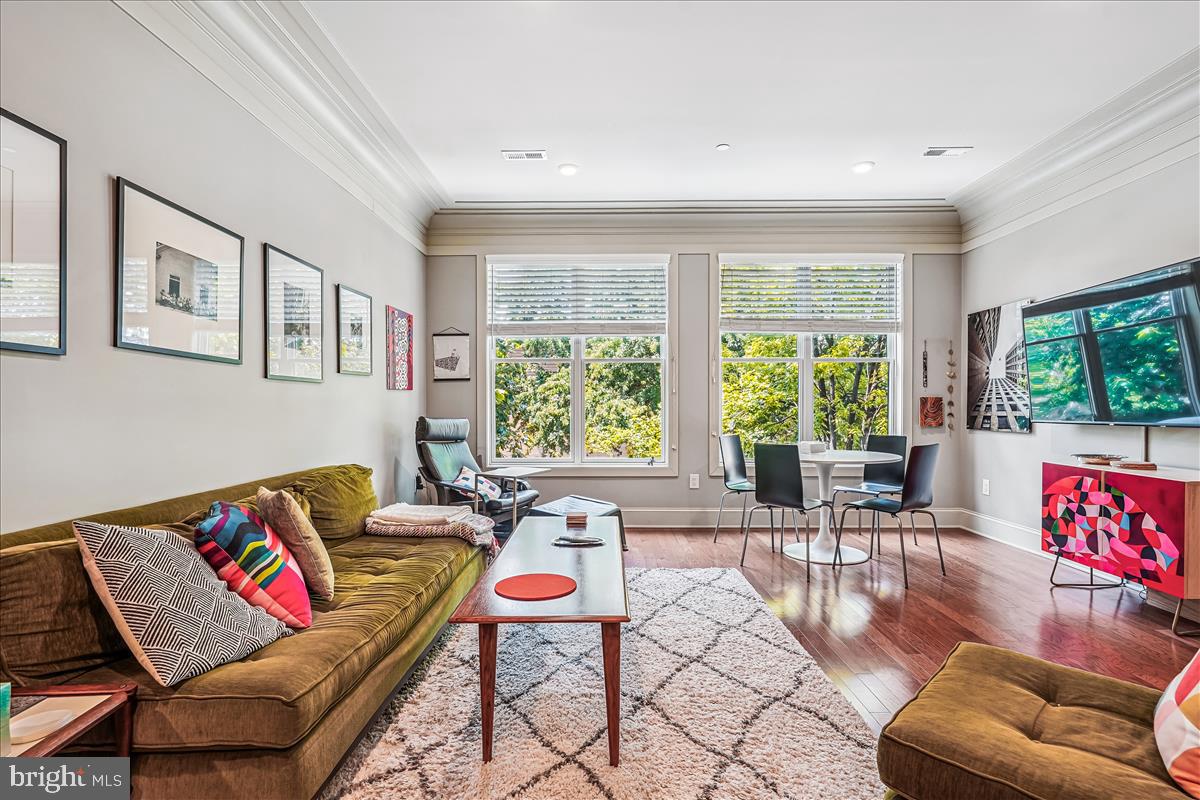 1301 H Street Northeast, Unit 2 Washington, DC 20002 - Photo 2 of 36 a living room with furniture and a large window
