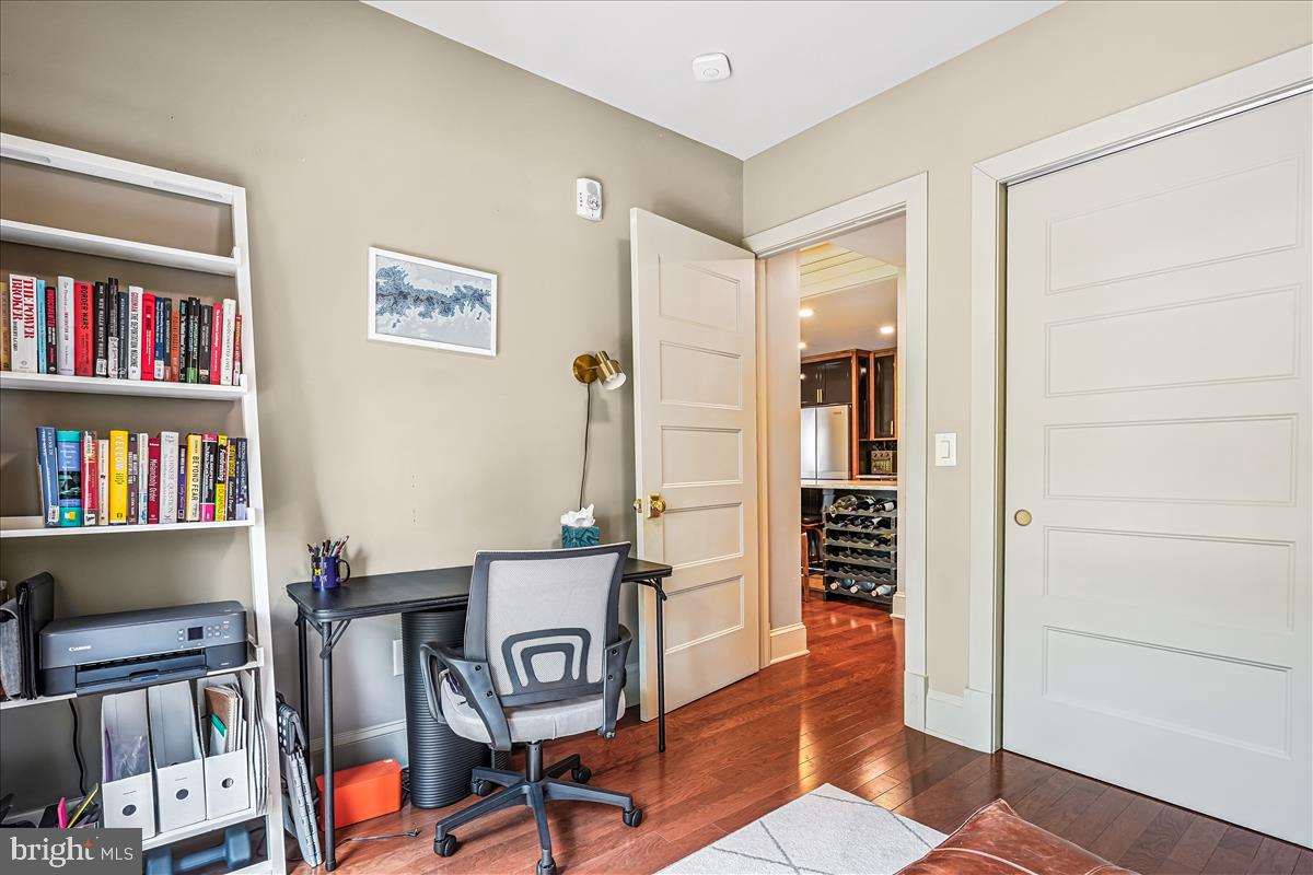 1301 H Street Northeast, Unit 2 Washington, DC 20002 - Photo 22 of 36 a view of a livingroom with furniture and bookshelf