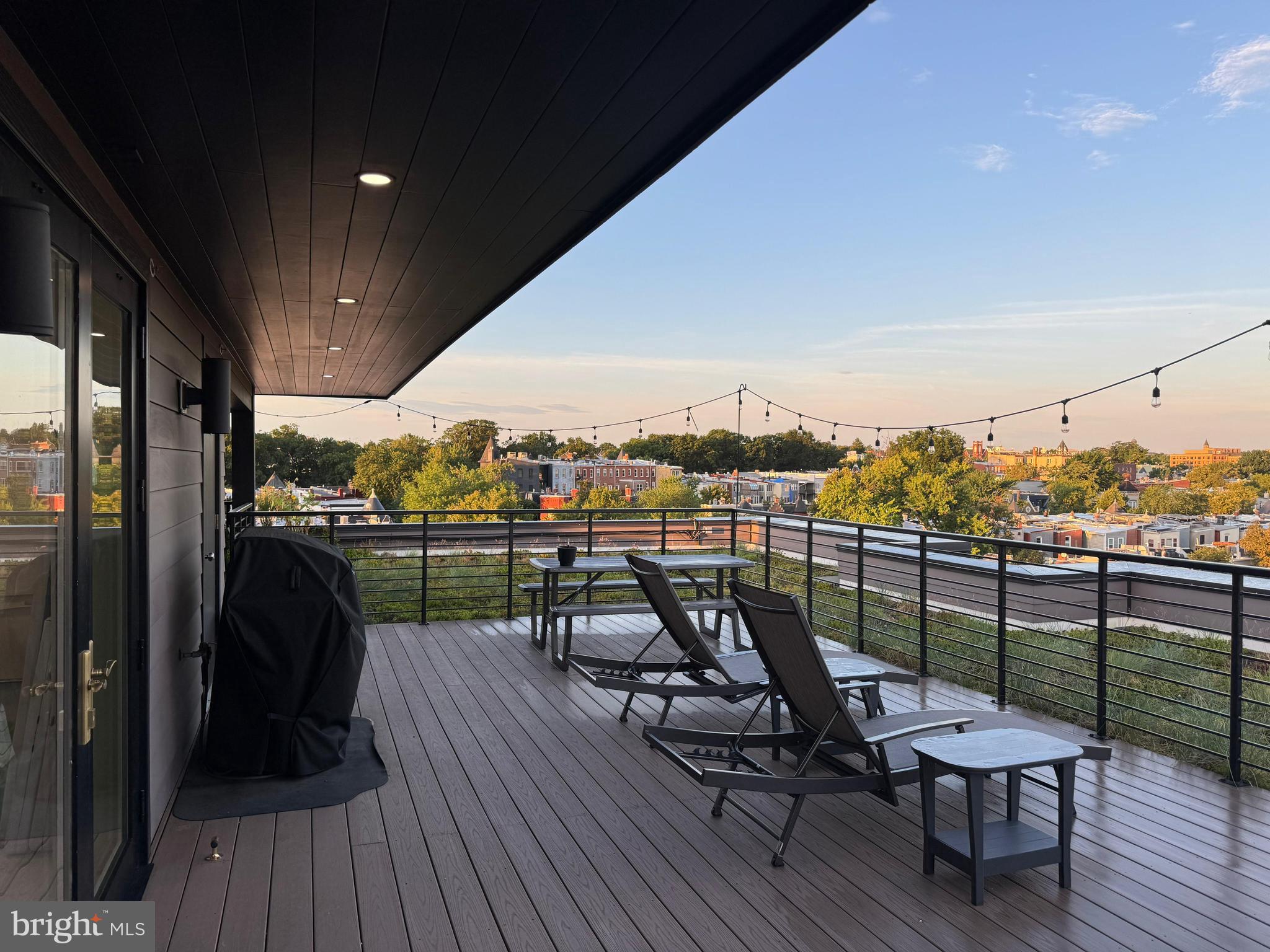 1301 H Street Northeast, Unit 2 Washington, DC 20002 - Photo 36 of 36 a view of a balcony with furniture and wooden floor