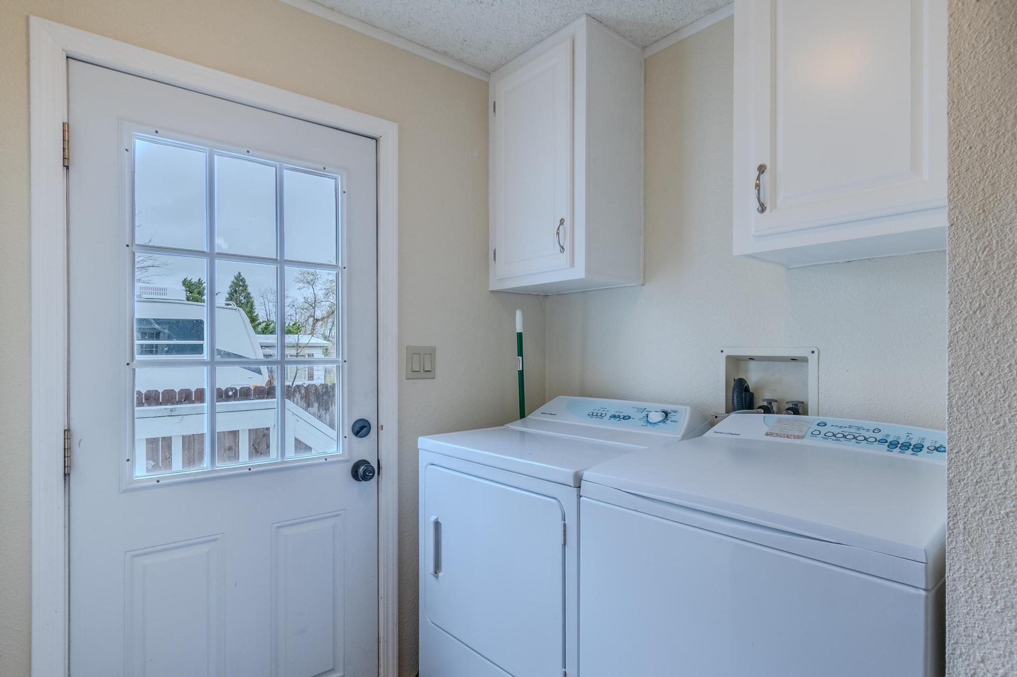 939 South Valley View Road, Unit 19 Ashland, OR 97520 - Photo 11 of 26 a utility room with dryer and washer